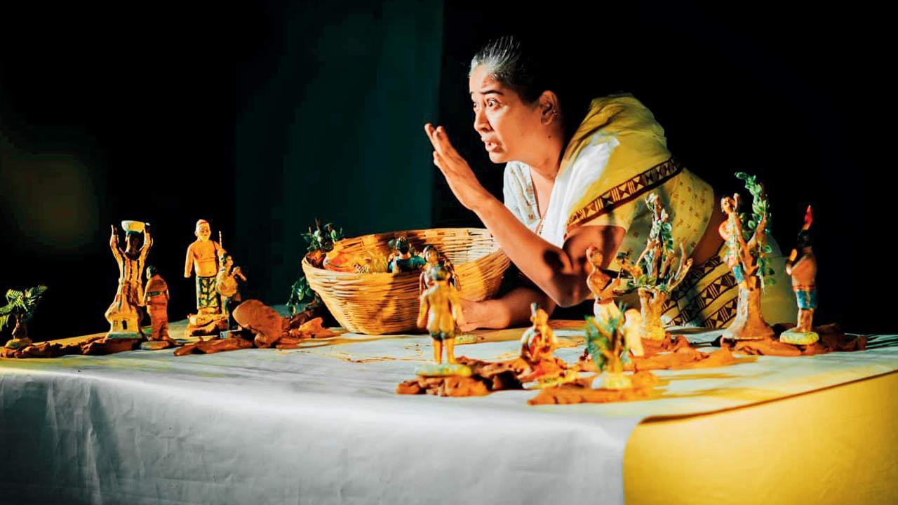Choiti Ghosh in performance with her miniature clay dolls 