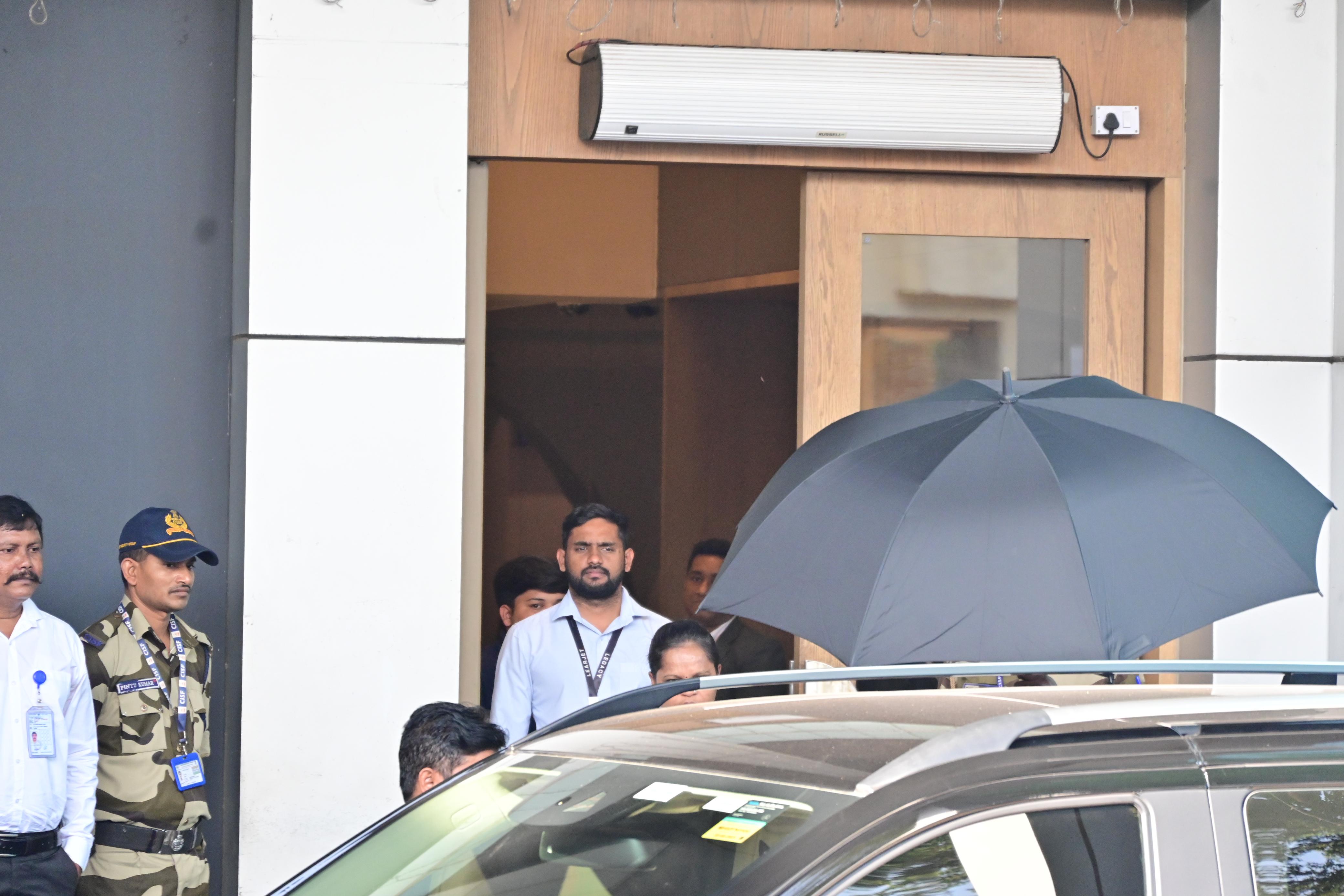 Deepika Padukone pulled a Shah Rukh Khan as she took cover under a big black umbrella as she arrived in Mumbai after attending Cartier's 25th anniversary event in Dubai
