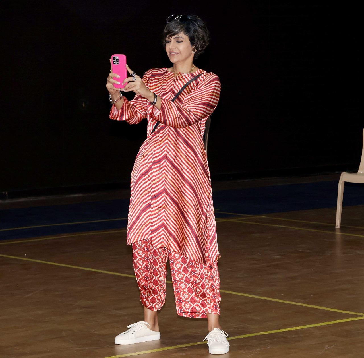 This picture shows Mandira clicking pictures of her kids