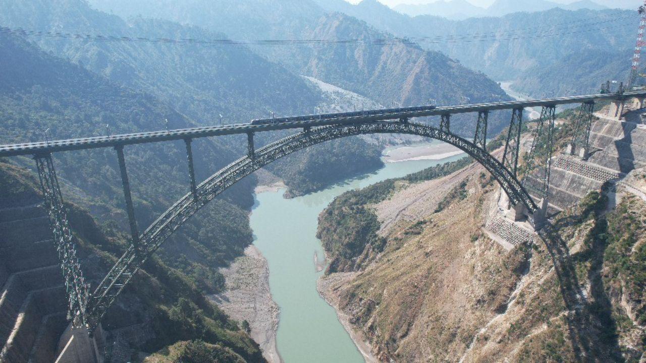 The Chenab Bridge, the world’s highest railway bridge at 359 meters above sea level, stands tall above the Chenab River, surpassing the Eiffel Tower by 35 meters