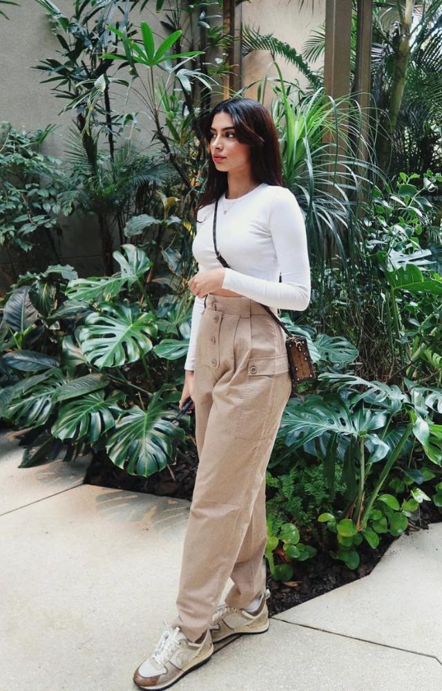 Simple and chic is your style? These cargo pants with a white crop top and a sling bag should be your go to look