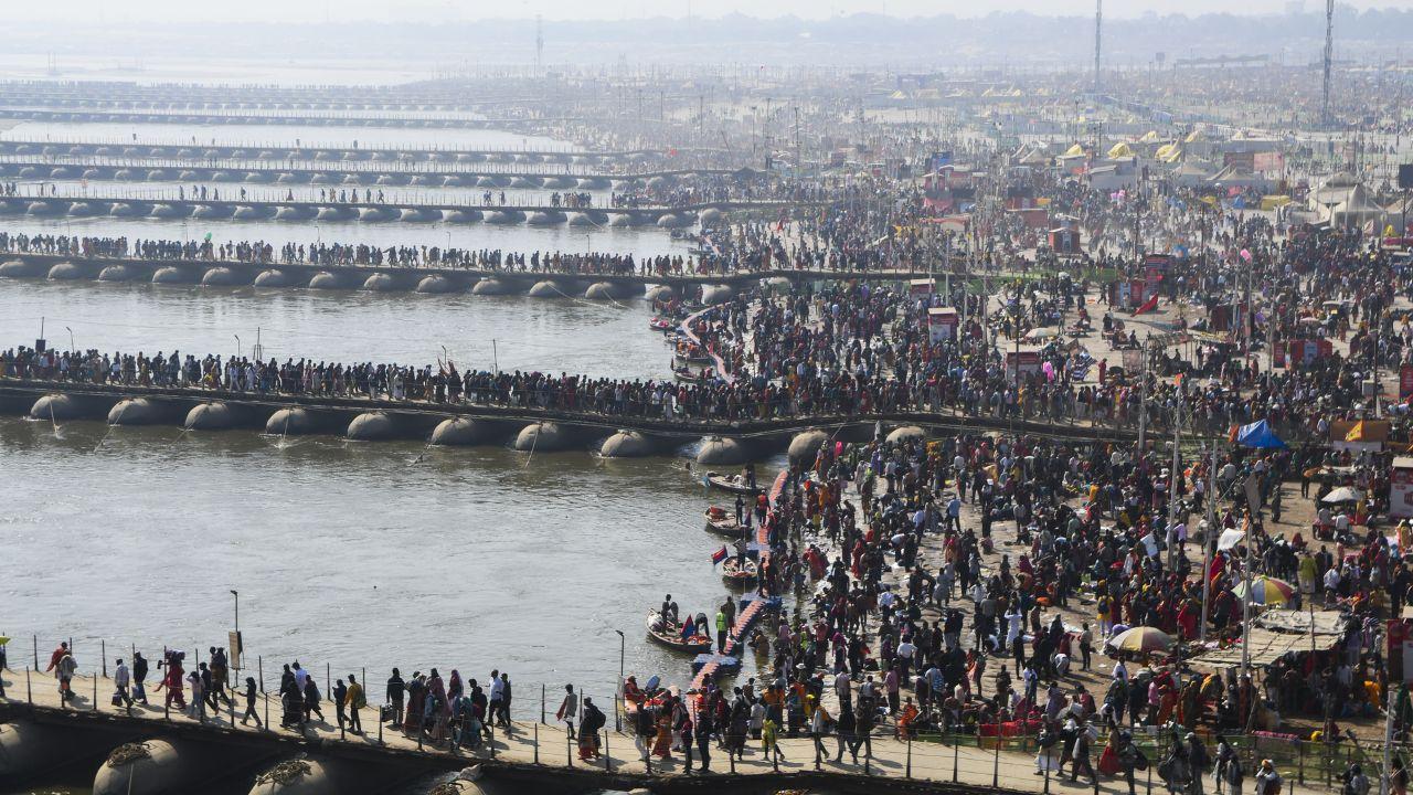 Devotees arrive to take a holy dip in the Ganga river at the Sangam on the eve of Maghi Purnima bath festival during the Maha Kumbh Mela