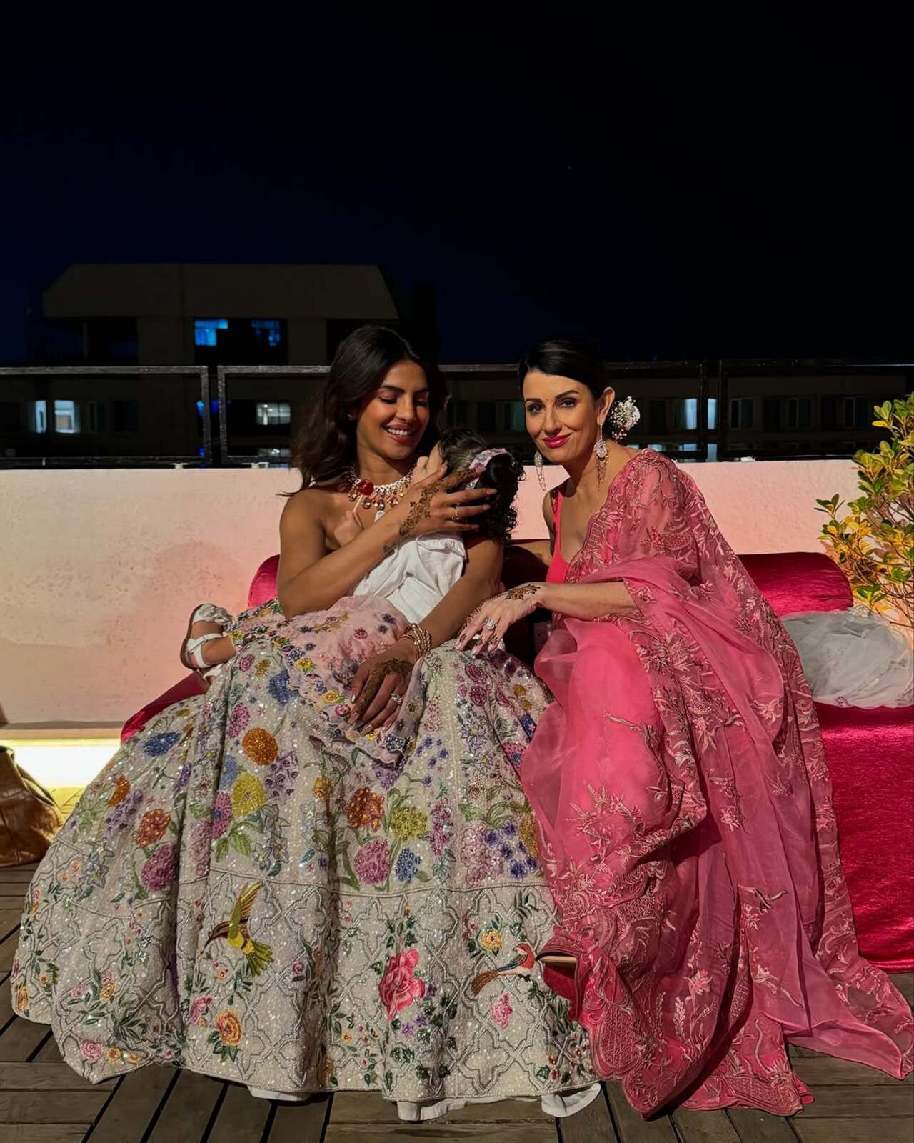 Priyanka Chopra looked ethereal as ever during the mehendi celebrations, donning an ivory dress that featured a sleeveless corset-style choli paired with a lehenga skirt.