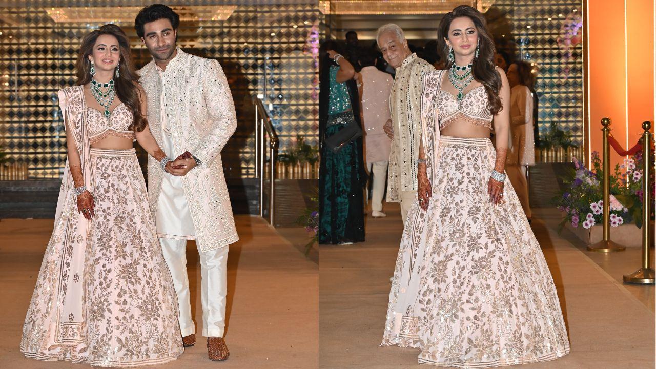 The groom, Aadar Jain, looked effortlessly handsome in a light pink bandhgala, a classic yet contemporary choice. His refined look was elevated by intricate detailing, making him the picture of elegance.
The bride, Alekha Advani, radiated beauty in a stunning light pink lehenga adorned with floral work that caught everyone's attention. Together, they made a striking couple, with their outfits beautifully capturing the essence of the celebration