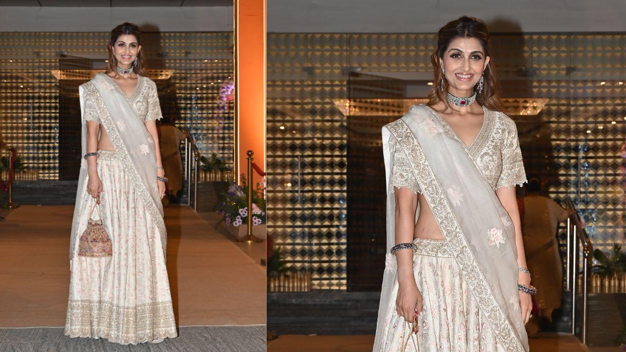 Actress Akansha Malhotra going simple with an off-white lehenga with golden thread work paired with chocker necklace, pouch and bold eye makeup