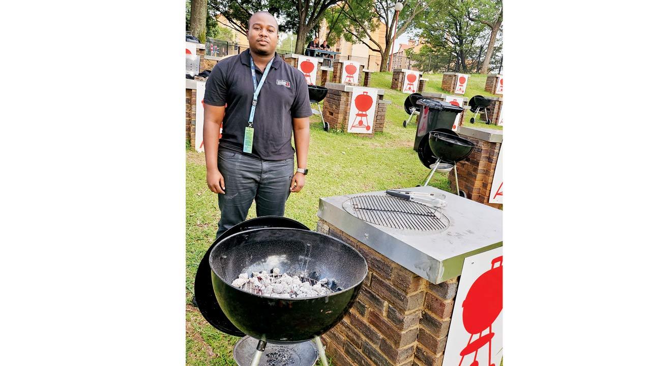 Luthando Sokudela, the man in charge of the barbecue pits