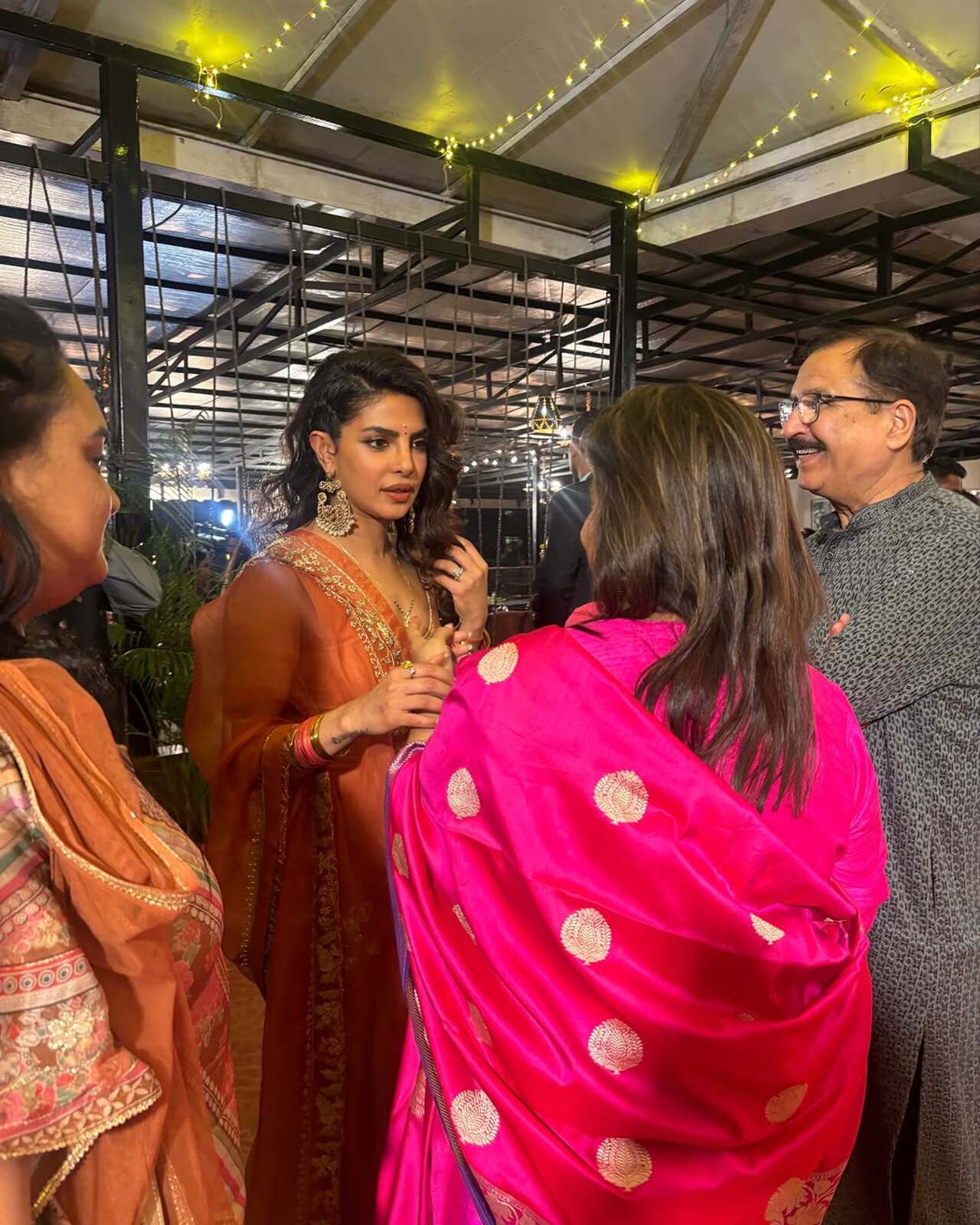 The global star, who has been in India for a few weeks now, made a grand appearance at the event, exuding elegance in an orange traditional outfit while accompanied by her adorable daughter, Malti Marie.