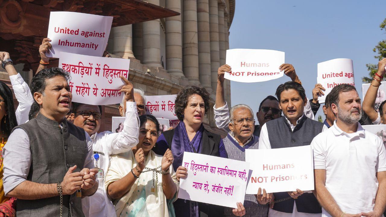Opposition members protest over US deportation of Indians, several MPs sport handcuffs in Parliament