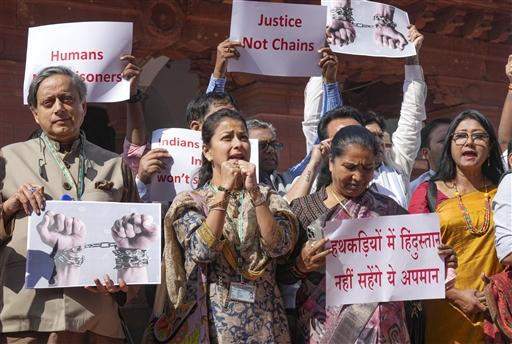 Protesters held placards reading 