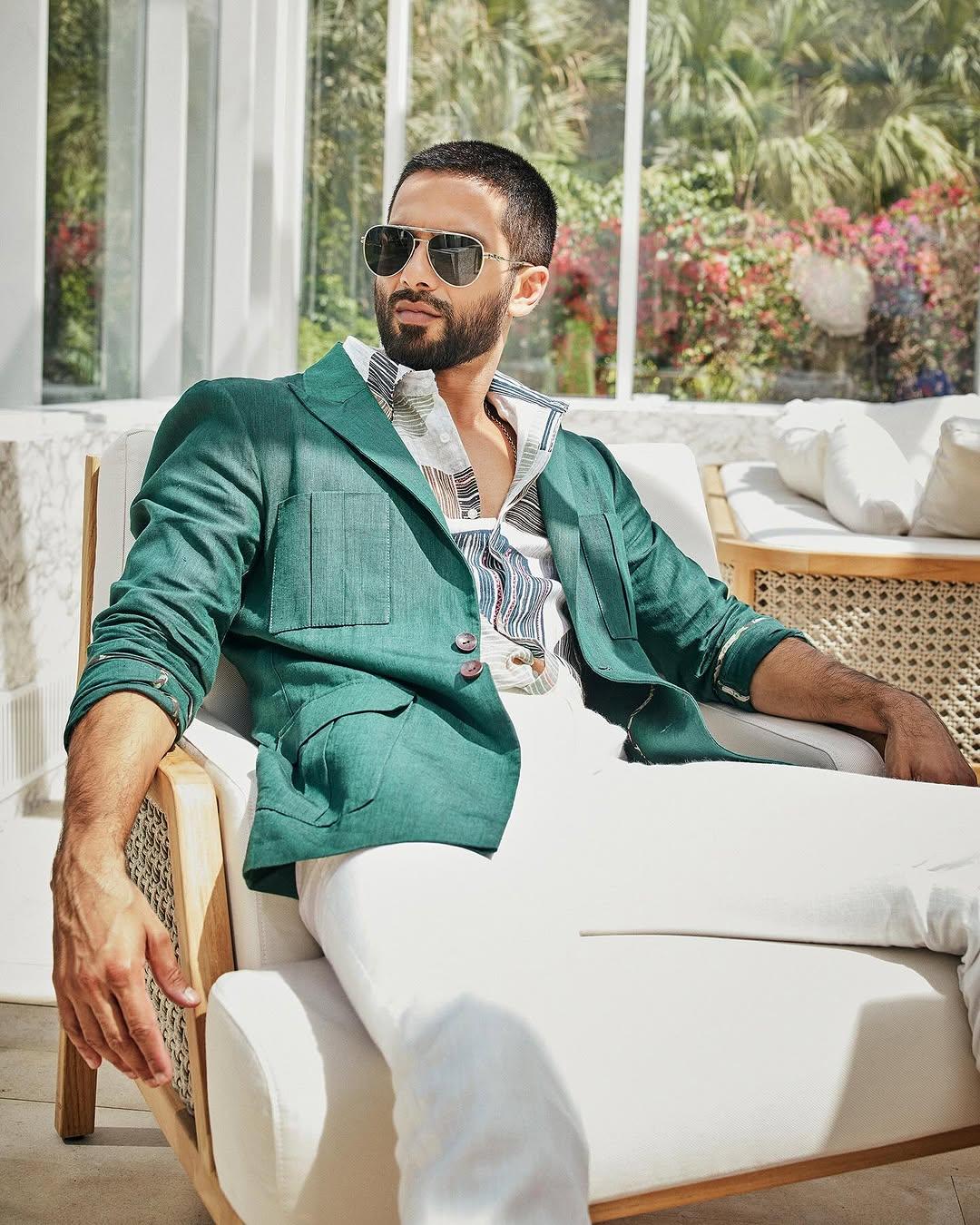 Birthday -
Is it your birthday and you wish to give main character energy? Then go for this white pant and printed shirt paired with a green blazer—Shahid Kapoor’s look is just right.