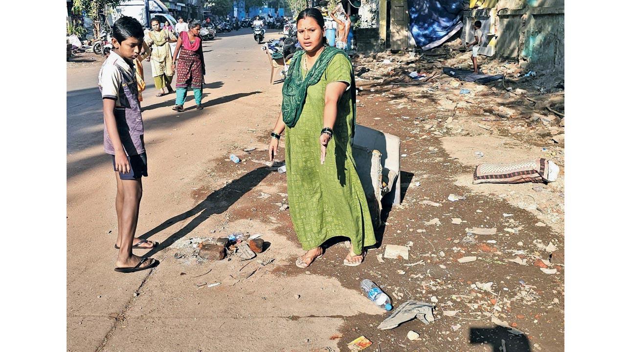 A neighbour of the family points to the spot where the accident happened
