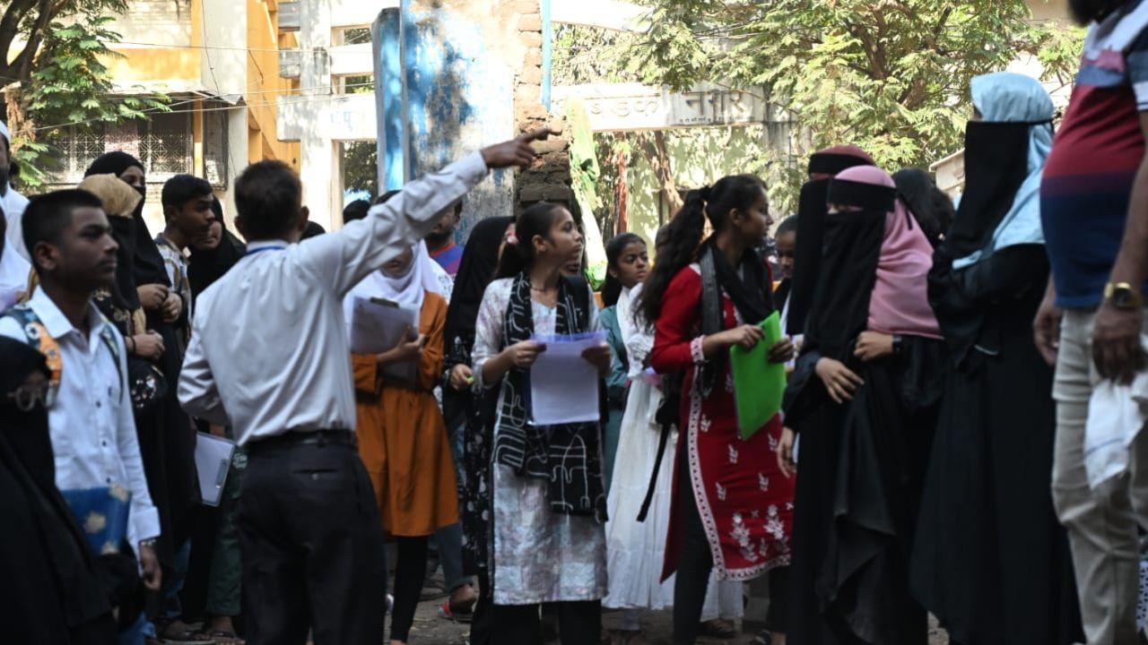 Parents waiting outside exam centre as they drop off their children who are appearing for the SSC board exams on Friday (PIC/Sayyed Sameer Abedi)