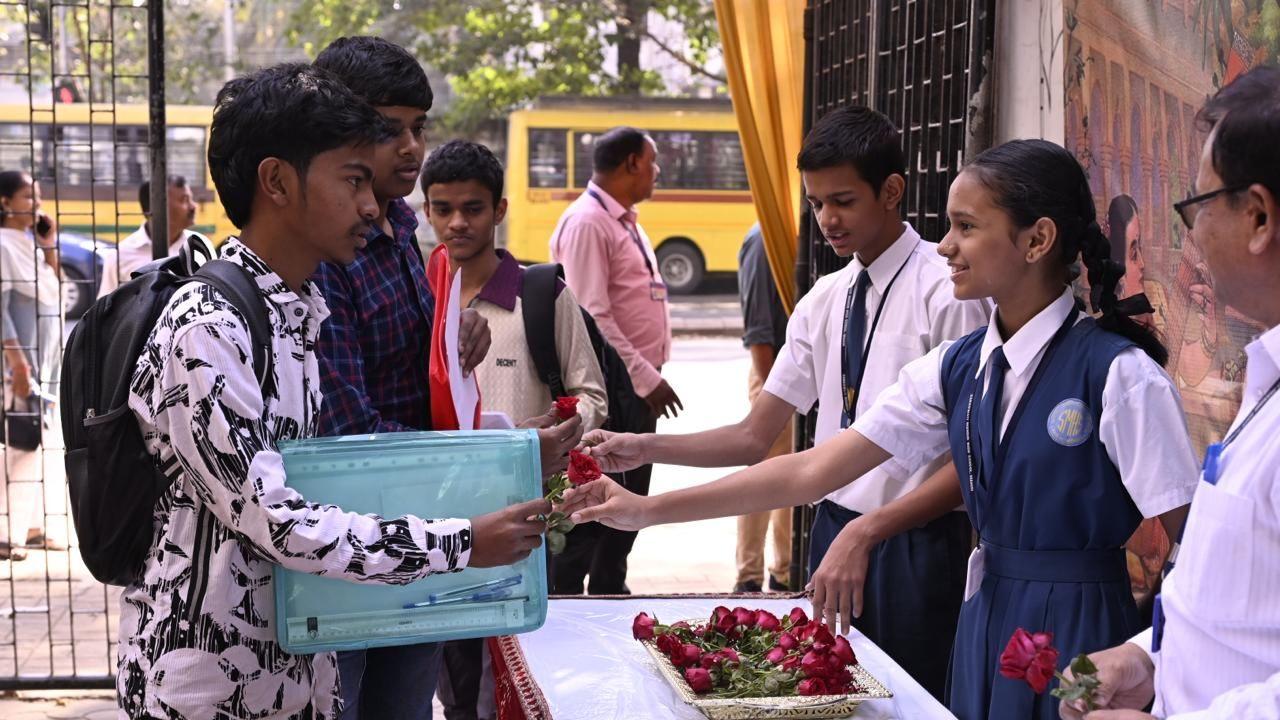 Roses being distributed outside Saraswati Mandir High School in Mahim in order to cheer up the students appearing for their SSC exams. (PIC/Ashish Raje)