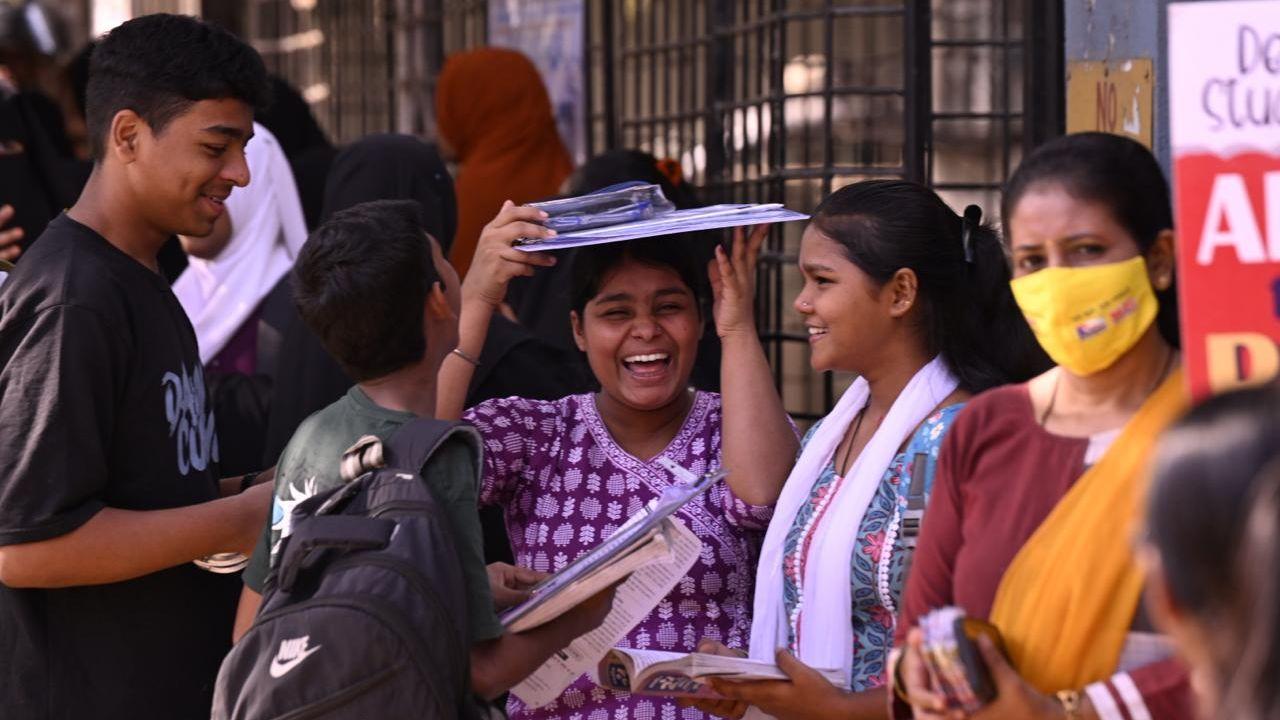 Students shrugging off exam stress by engaging with friends as they do their last revision outside Mahims' Saraswati Mandir High School on Friday. (PIC/Ashish Raje)