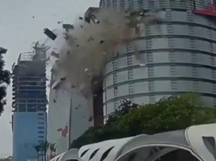 The explosion took place at approximately 11:30 a.m., prompting the immediate deployment of dozens of firefighters to the scene to contain the situation. Streets surrounding the department store were littered with debris and shattered glass, with emergency responders working to clear the area and assess further risks.