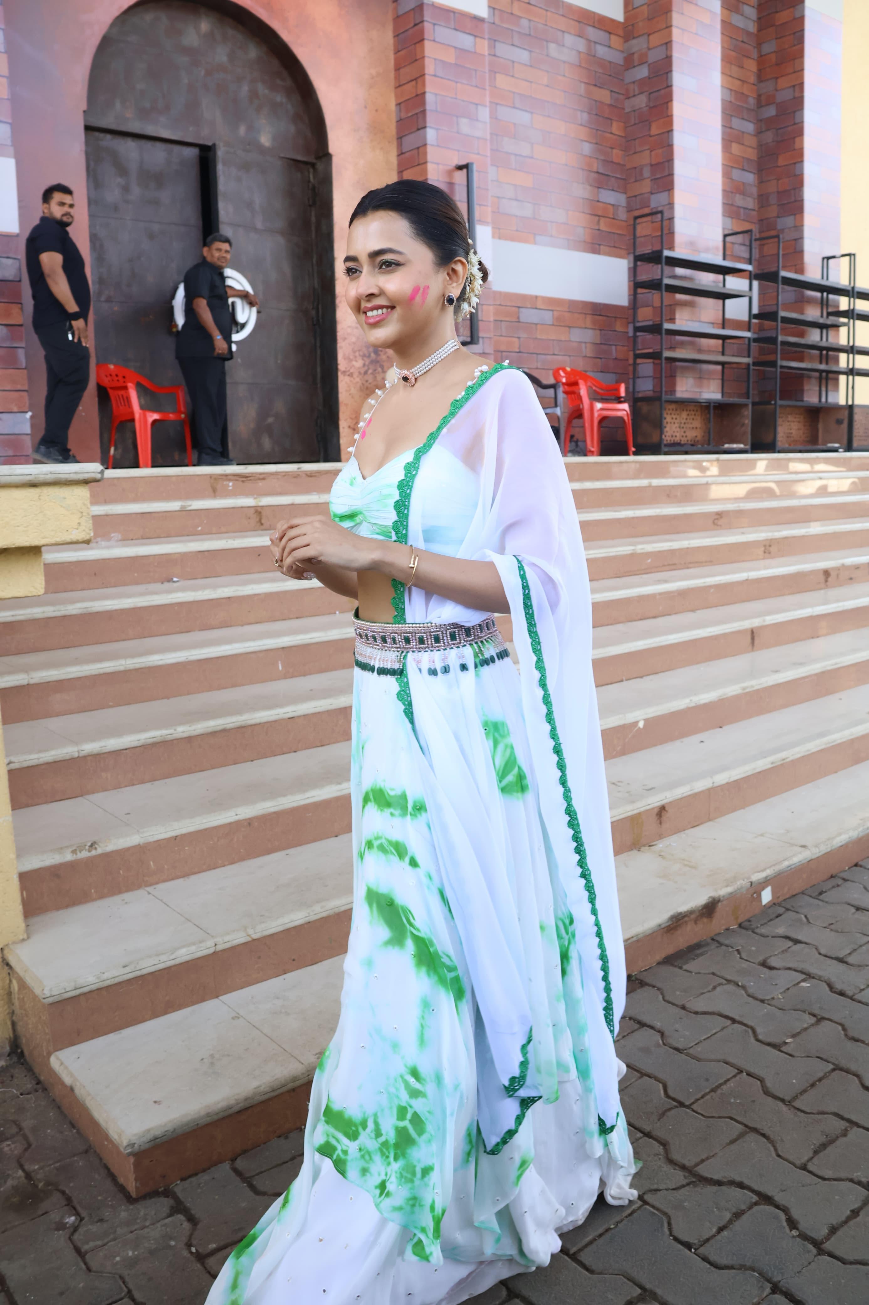 Tejasswi was seen in a simple white lehenga with some colour on her cheek, possibly shooting for a Holi special episode of the comedy reality show