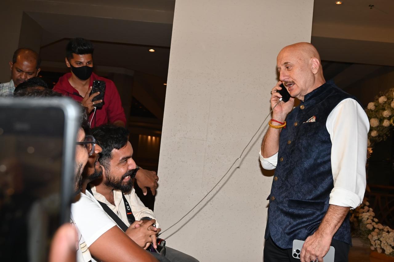 Anupam Kher was seen engaging and interacting with the paps at the party venue