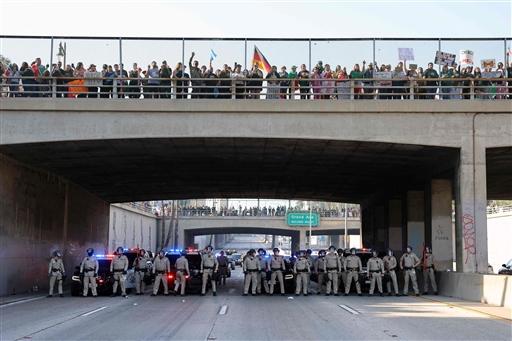 Protesters waving Mexican flags and carrying anti-Trump signs gathered on Olvera Street before moving onto the 101 Freeway, forcing its closure. The Los Angeles Police Department (LAPD) and California Highway Patrol (CHP) shut down roads and warned motorists to avoid downtown Los Angeles.
 