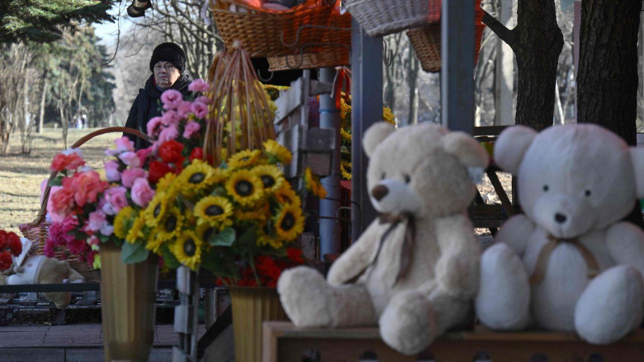A flower vendor waits for customers a day before Valentine's Day on a street in the city of Ukraine's Kramatorsk amid the Russian invasion