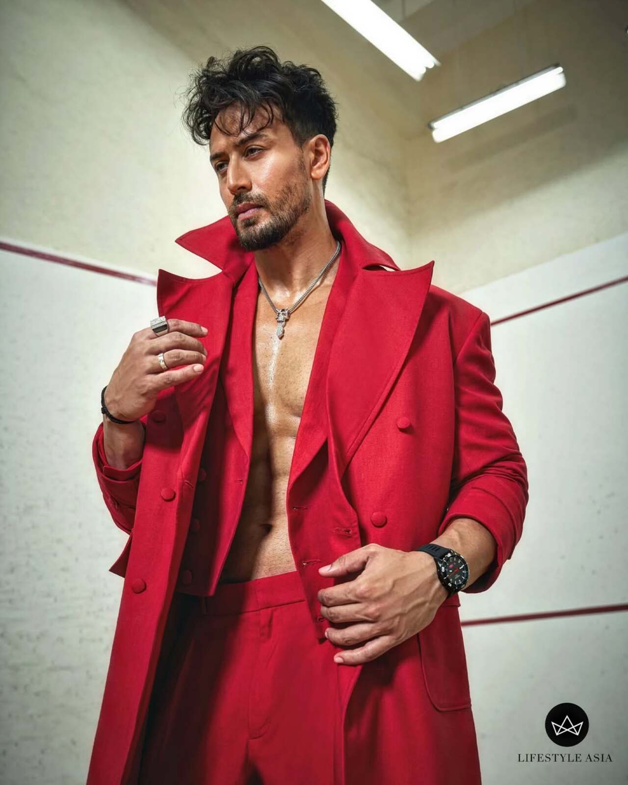 Tiger Shroff is here to flaunt his sculpted physique but also reminding that red on red can be an absolute winner if done the right way.