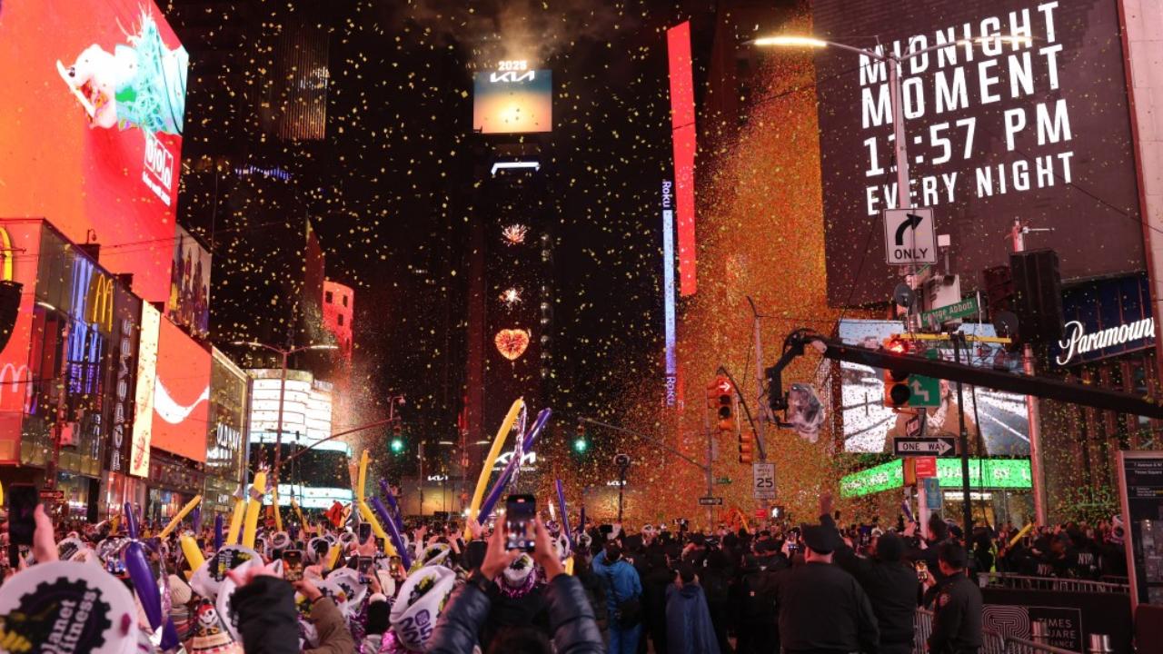 Revellers celebrate the New Year at Times Square in New York City, just after midnight on January 1, 2025 (Pic: AFP)