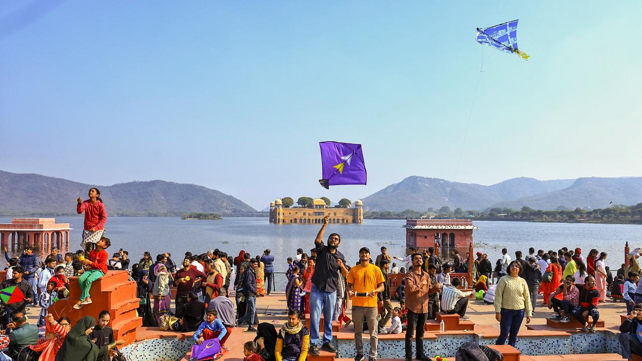 People visit 'Jal Mahal Paal' during the kite festival on Makar Sankranti in Jaipur (Pic: PTI)