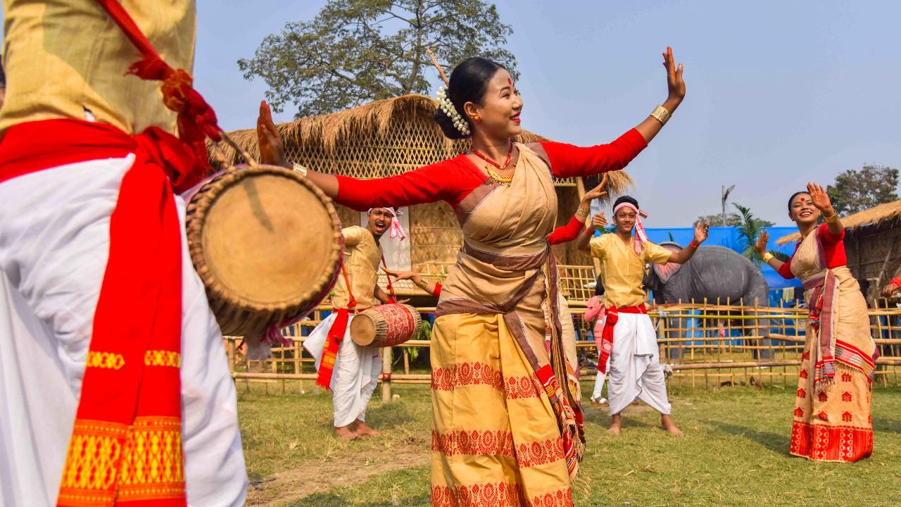 People in traditional Assamese attire dance during celebrations of the Bhogali Bihu or Magh Bihu festival in Nagaon district (Pic: PTI)