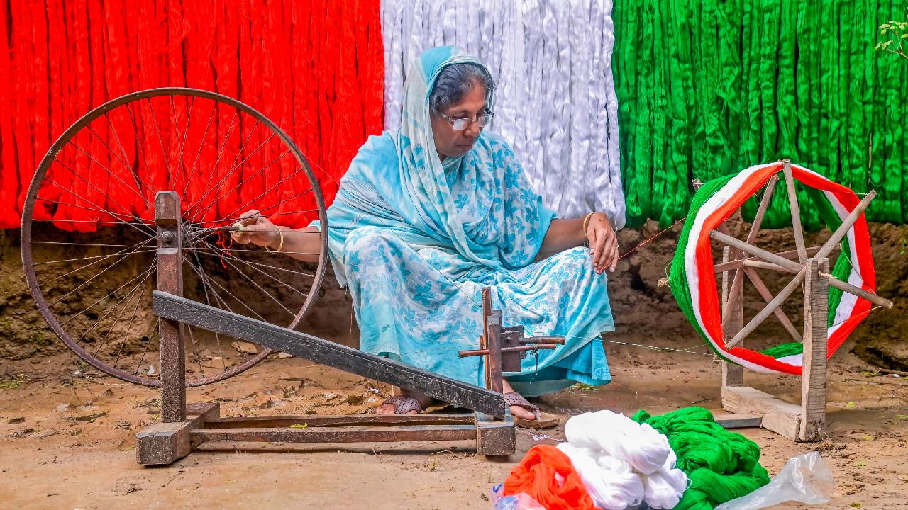 A woman prepares yarn to make the tricolour ahead of Republic Day 2025 in Nadia, West Bengal