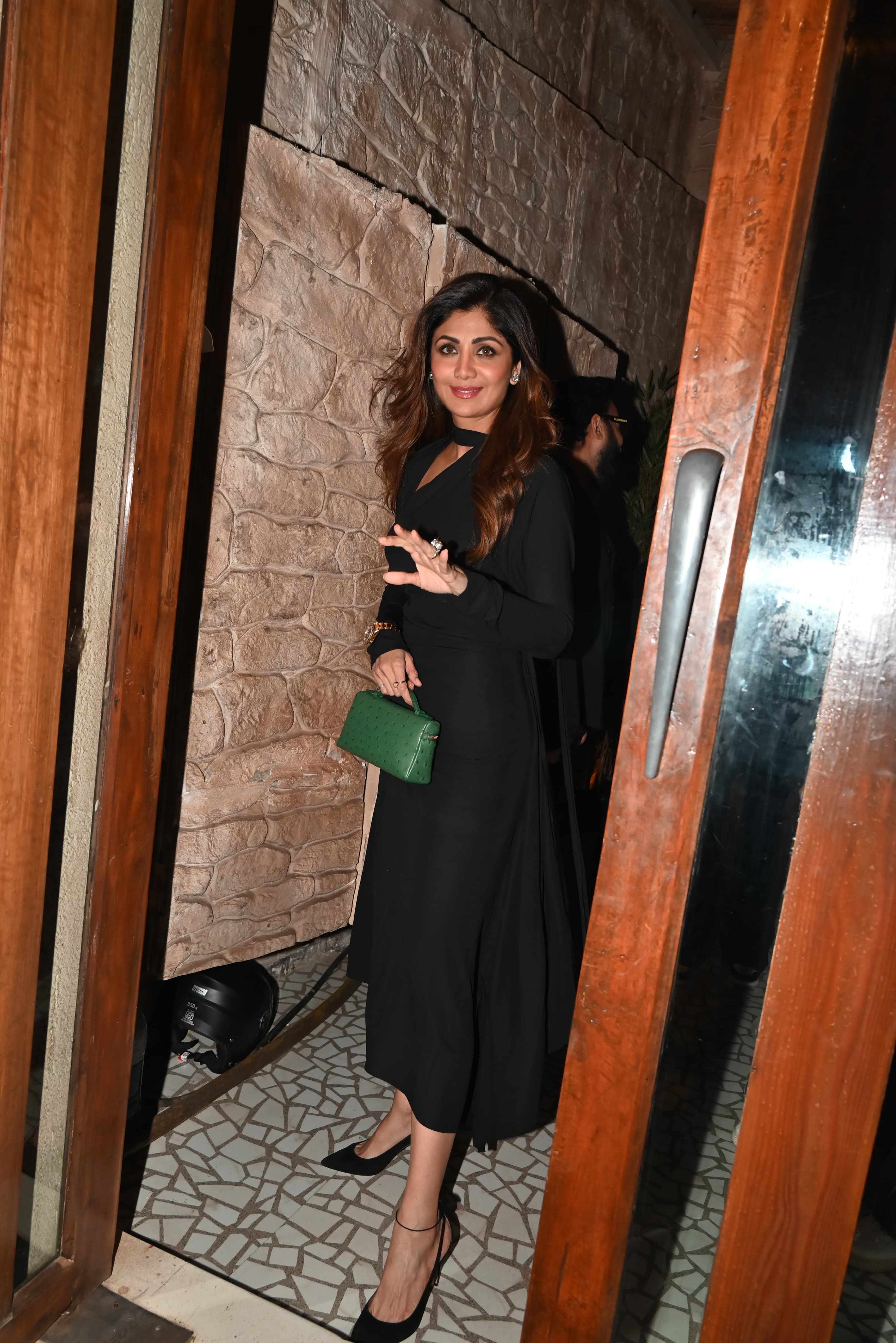 Shilpa Shetty looked drop-dead gorgeous in a black dress and carried a green mini purse