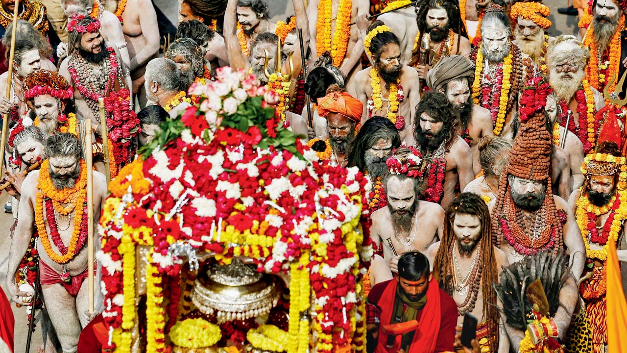 Sadhus walk during a religious procession of the Niranjani Akhara, in Prayagraj on January 4, 2025. Pic/Getty Images