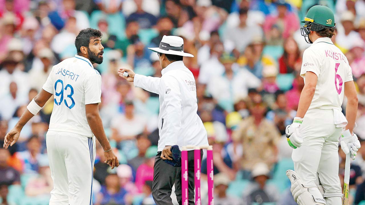 Umpire Sharfuddoula Saikat intervenes after Jasprit Bumrah (left) and Sam Konstas get involved in a heated argument at the SCG