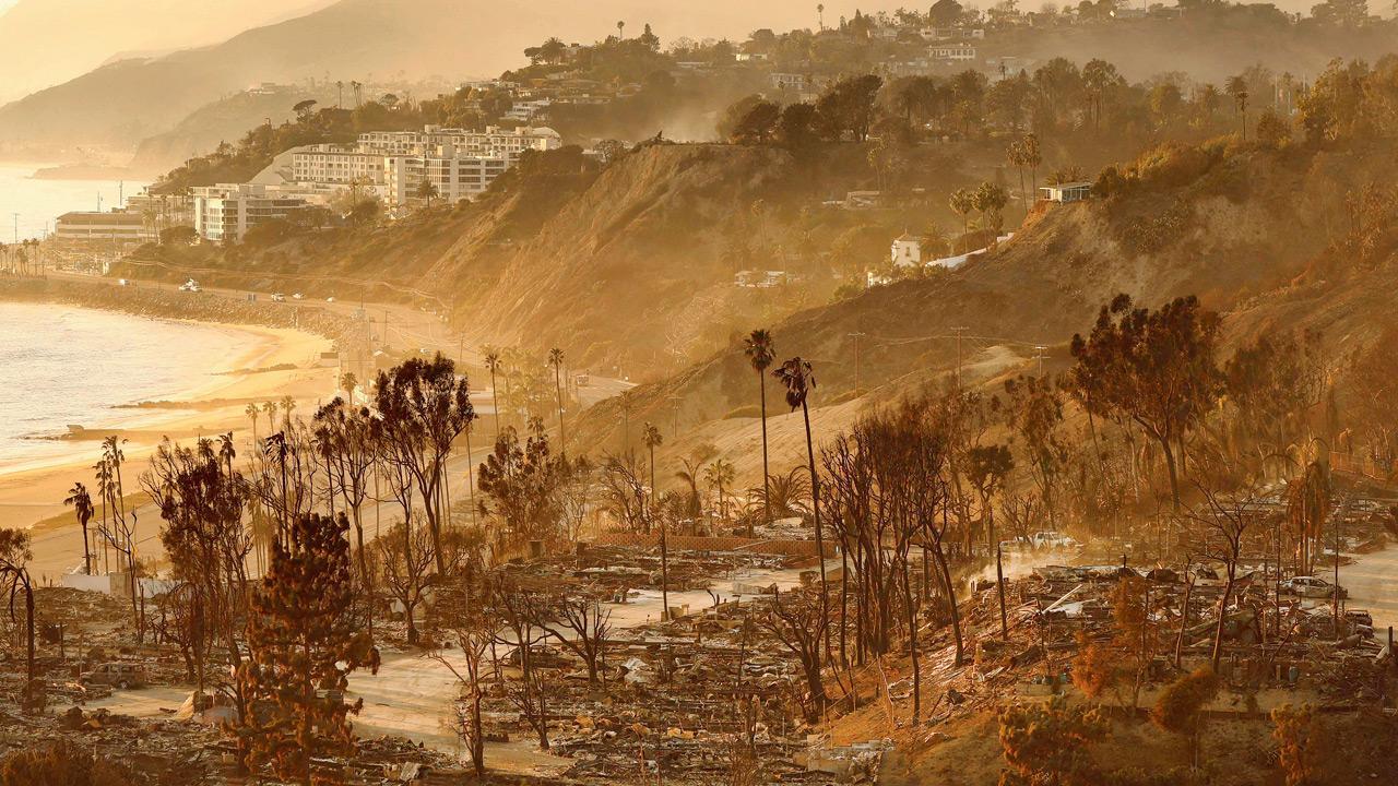 California residents return to still smouldering homes