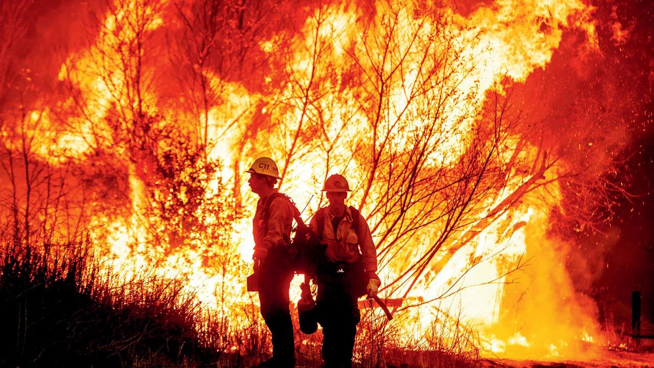 fire crews battle the Kenneth Fire which started on Thursday. Pics/AFP