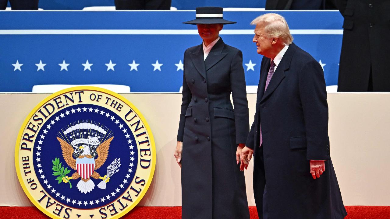 Melania wore a along navy coat and matching wide-brimmed hat -- which shielded her eyes in most photos. The hat hindered her commander-in-chief husband Donald Trump's attempts to give her a peck before his swearing-in. The wide-brimmed hat that also stole the show was by New York milliner Eric Javits.
