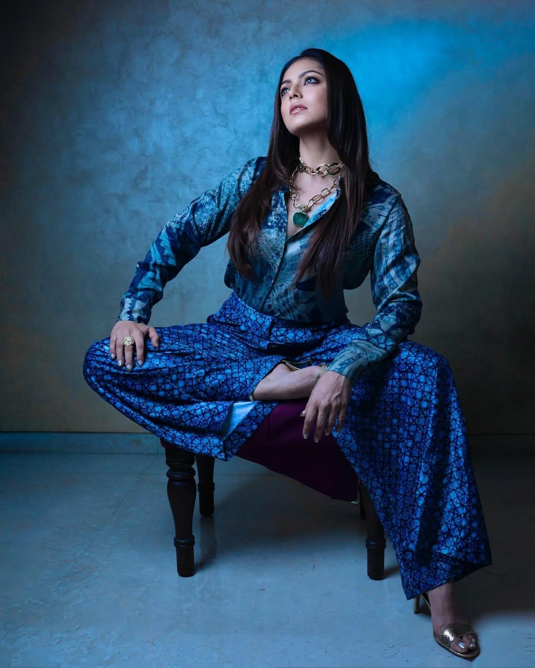 The actress wore a stylish shirt, paired it with printed pants, and added a touch of contrast with her golden sandals