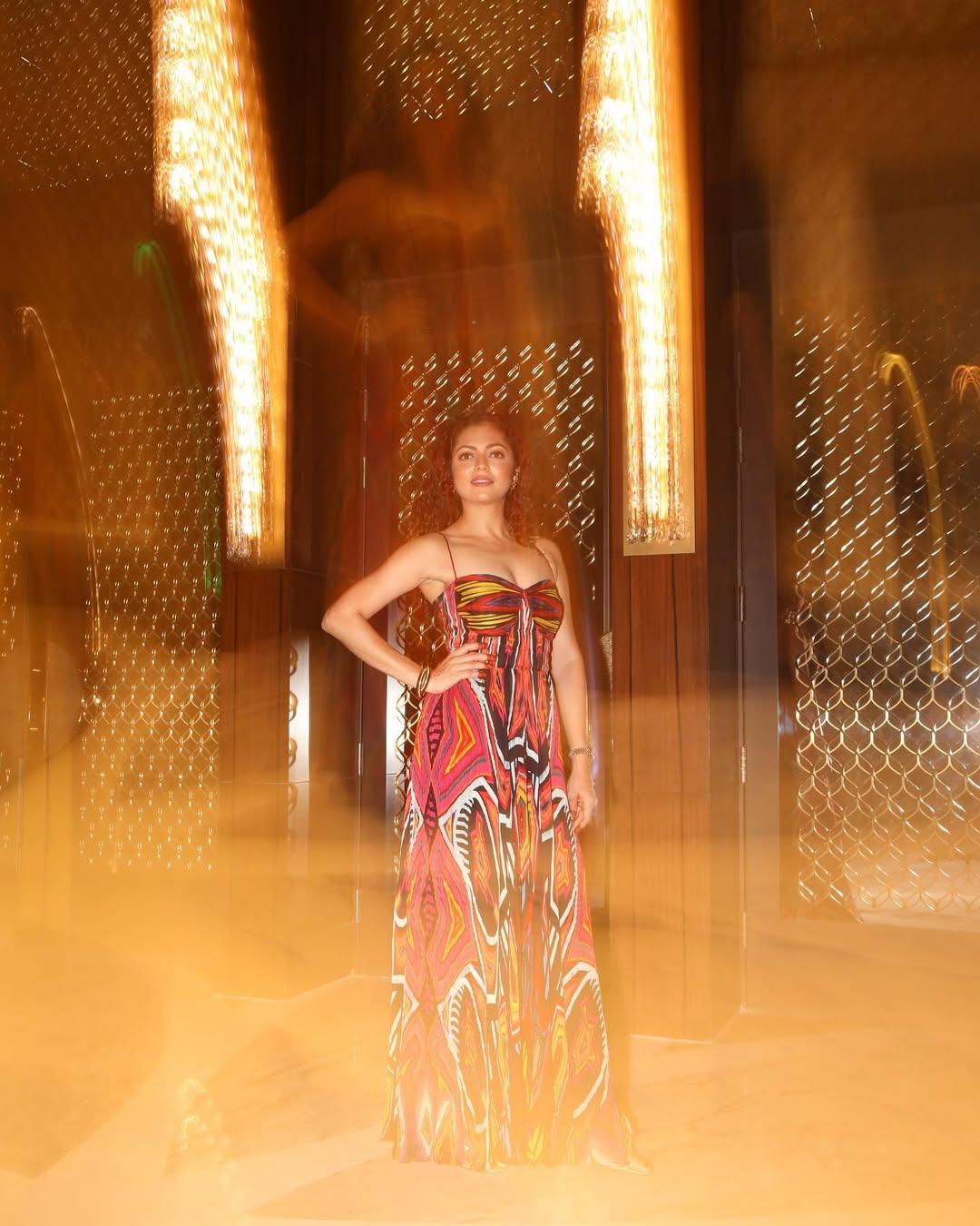 Blurry picture, but we loved the stunning 'fit. In this look, Dhami wore a strappy gown