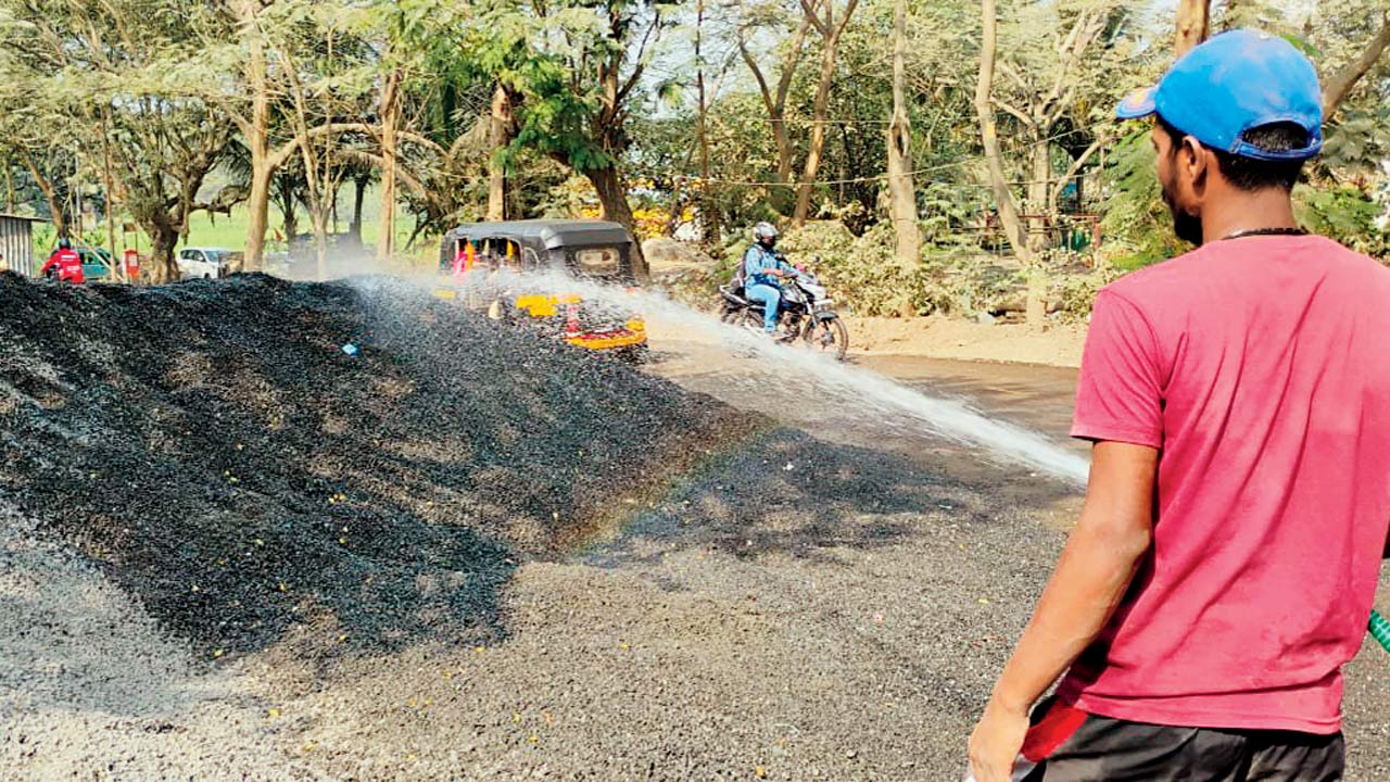 Water is sprayed at a construction site in Aarey Milk Colony to prevent the spread of dust. Pic/PWD