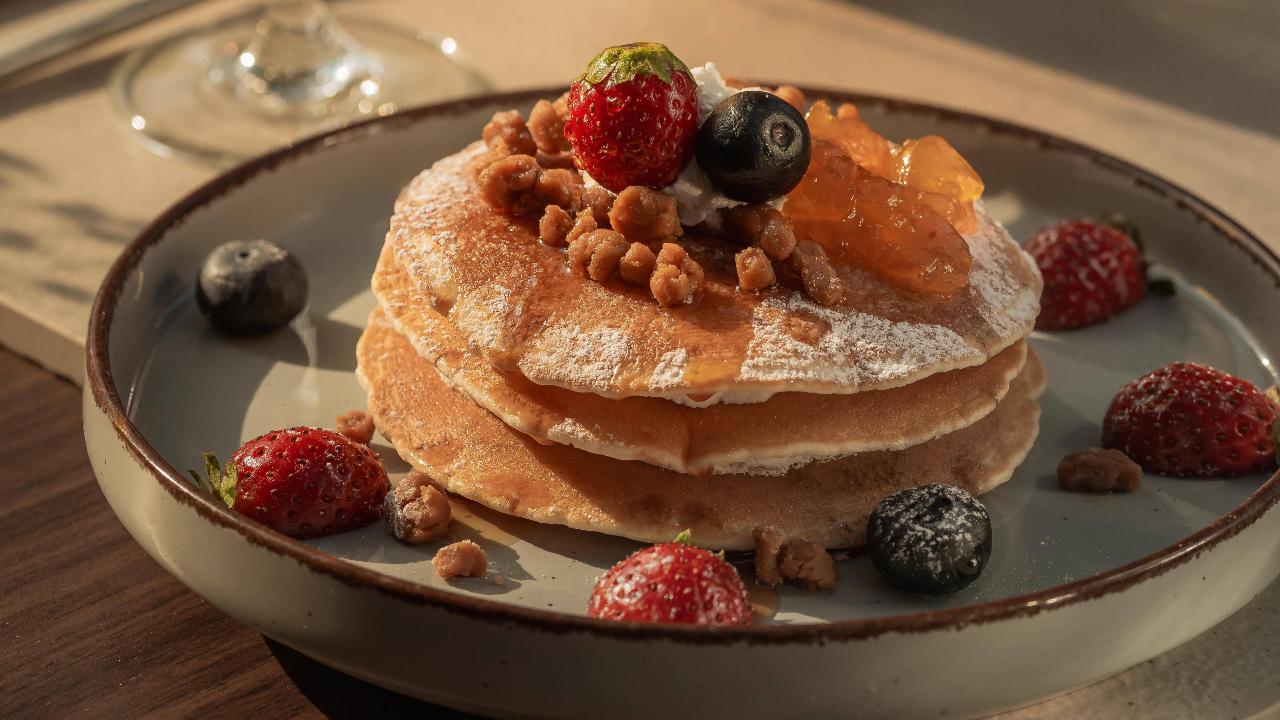 Weekend breakfast menuThe menu at Fiori offers a delightful mix of sweet and savory options. For a healthier option, try the Cereal Bowl Parfait, Pancake Stack with lemon whipped cream, and Apple & Cinnamon Stuffed French Toast. Diners can also enjoy savoury dishes such as Breakfast Burrito, Potato Rosti, Shakshuka, Croissant Sandwiches and Breakfast Bagels. Finish your breakfast with Cinnamon Rolls, Almond Croissants, Pain au Chocolat, and Banana Bread. Diners can pair their breakfast with coffees such as Whipped Cream Cheese Americano, Peanut Butter Flat White, Cinnamon Honey Latte, the bold Sea Salt Coconut Latte, the refreshing Espresso Tonic, and popular favorites like the Coconut Iced Latte and Café Bon-bon too.
Where: Fiori, Regenta SGs Greenotel, Gwalwadi, Old Mumbai - Pune Hwy, Lonavala, Maharashtra 410401 Time: 10 am onwards Contact number: 07410001661 