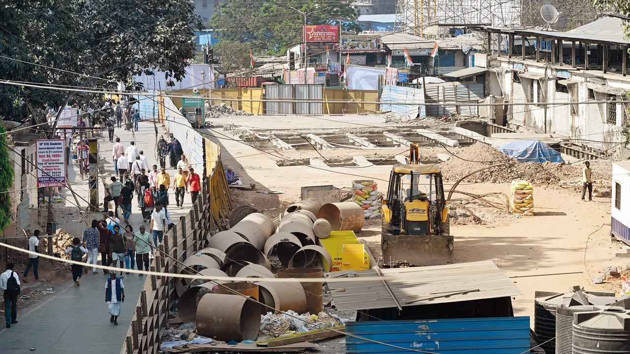 Pedestrians using the small portion of the bridge to travel between east and west. Pics/Atul Kamble 
