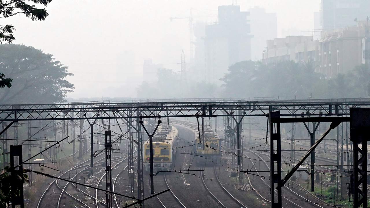 A layer of haze visible over railway tracks in Borivli. Pic/Nimesh Dave