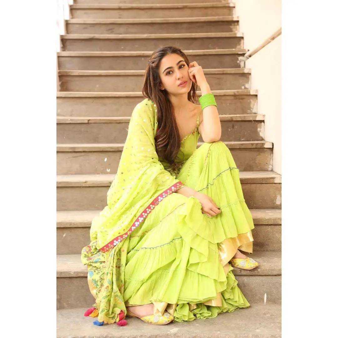 In yet another appearance, the actress stunned in a neon green outfit featuring a pink lace detail. She kept it simple, adding matching bangles to enhance her appearance.
 