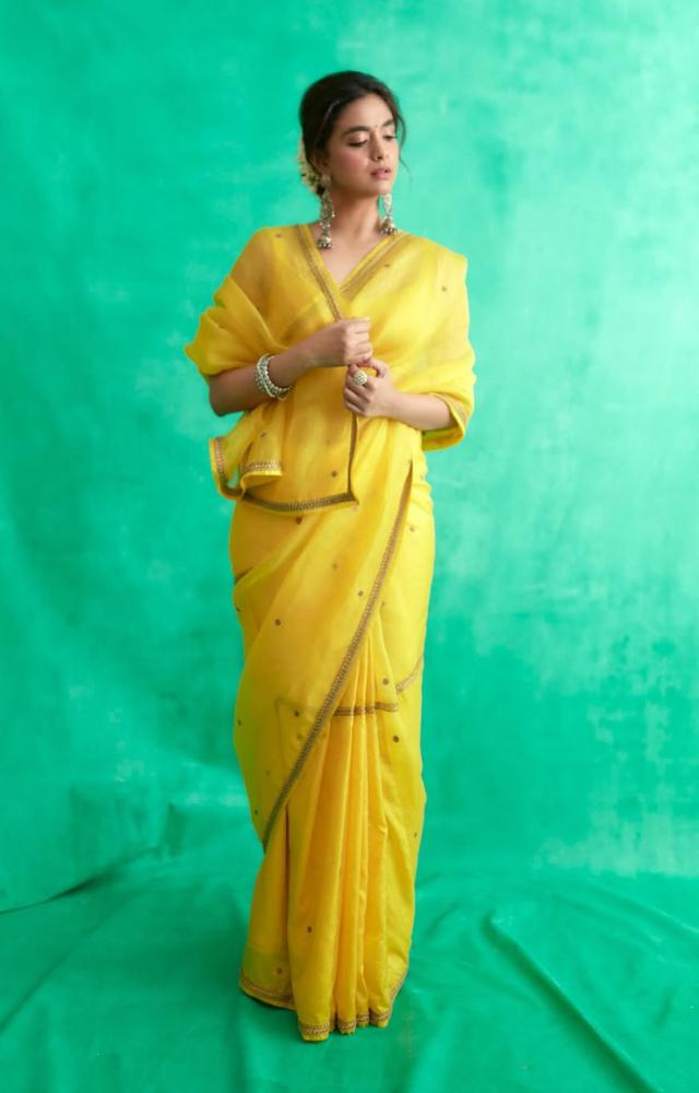 Keerthy nailed the perfect festive look in a yellow saree with a matching blouse. The saree featured a simple golden border and minimal gold prints
