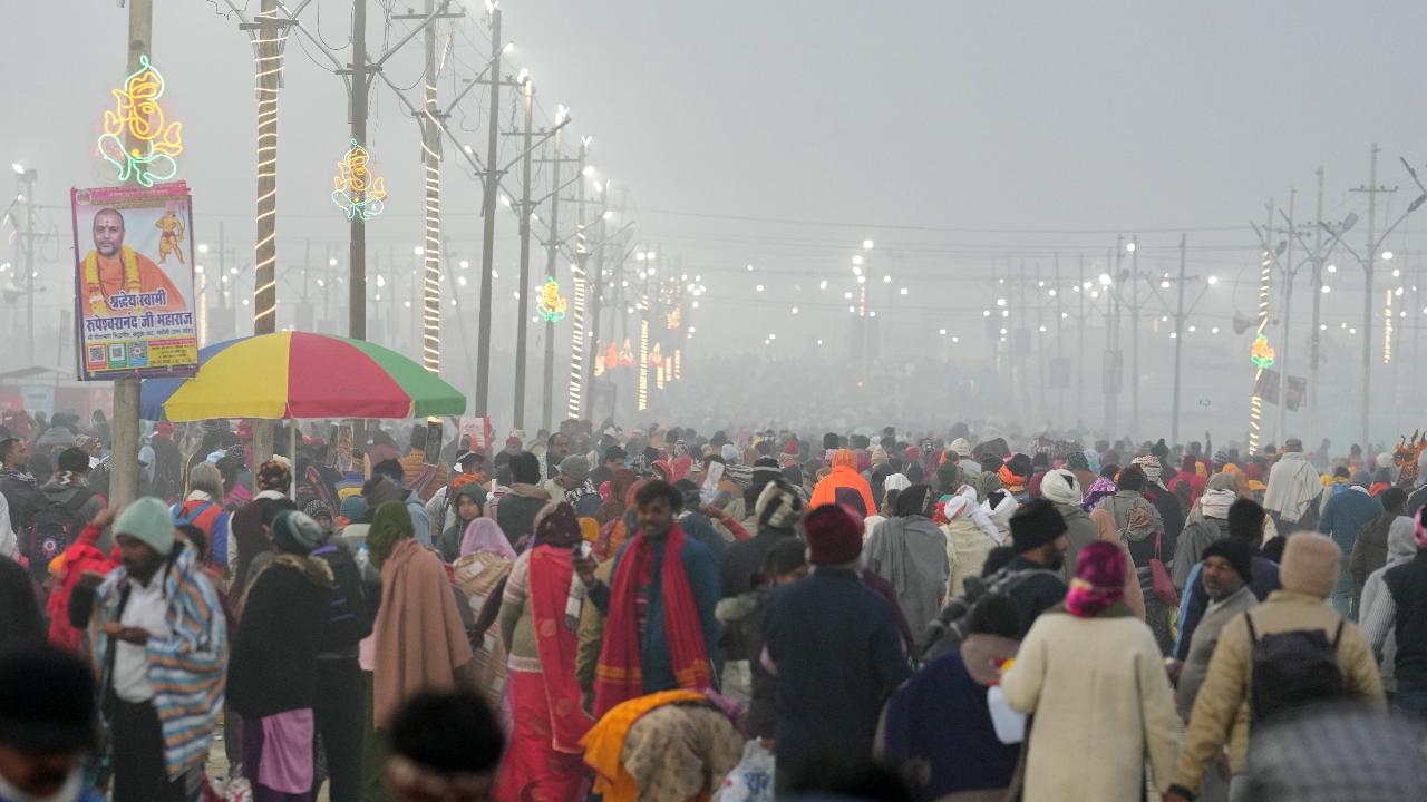 Devotees gather at Sangam to perform rituals on the first day of Maha Kumbh Mela 2025, in Prayagraj, Uttar Pradesh, Monday, Jan. 13, 2025.
