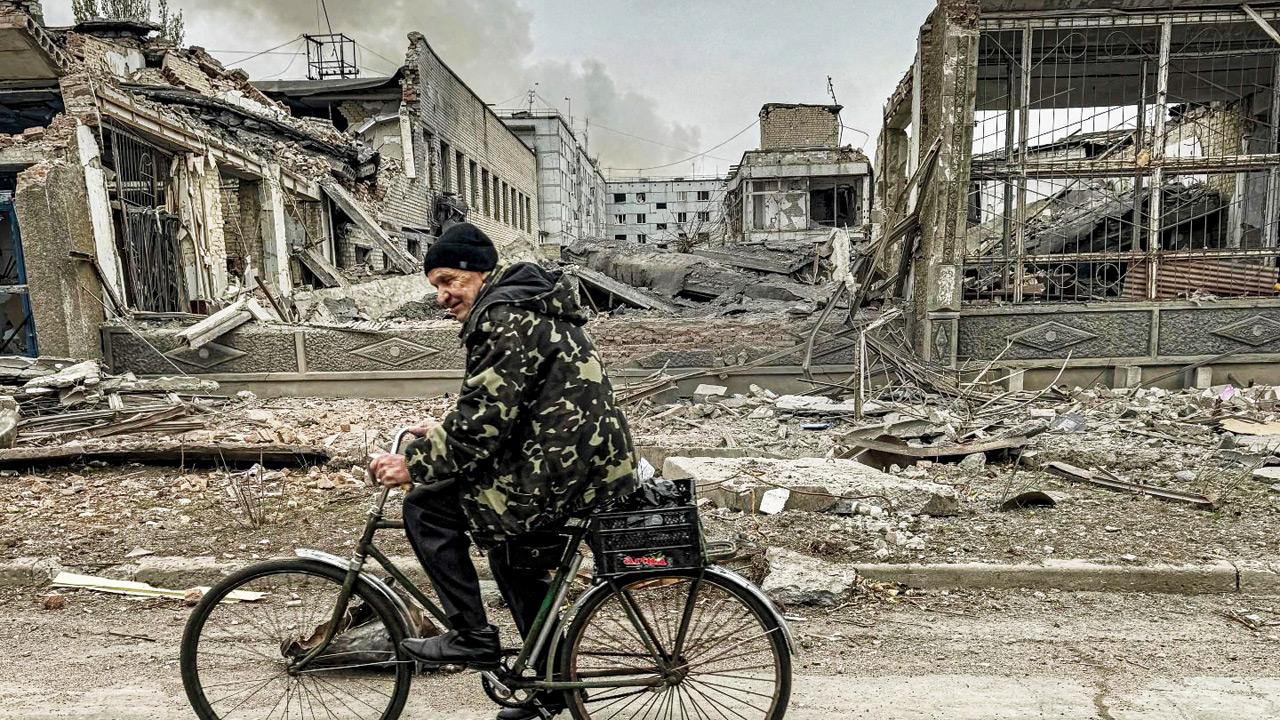 A man rides past the destroyed postal office in Kurakhove. File Pic/AP