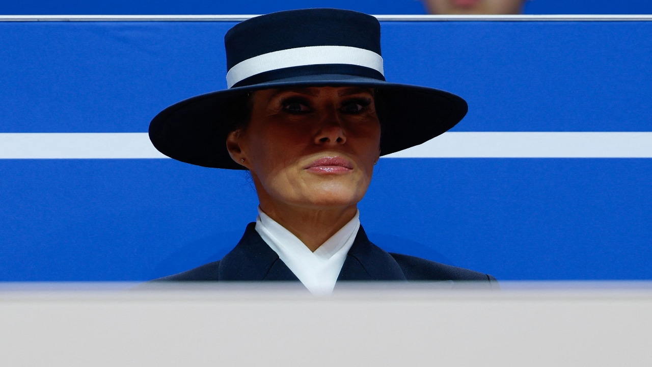 Some even compared her to Carmen Sandiego, referring to the franchise that spun off into a popular 1990s geography game show for kids, and featured a criminal mastermind dressed in a long, carmine trench coat and eye-obscuring fedora.