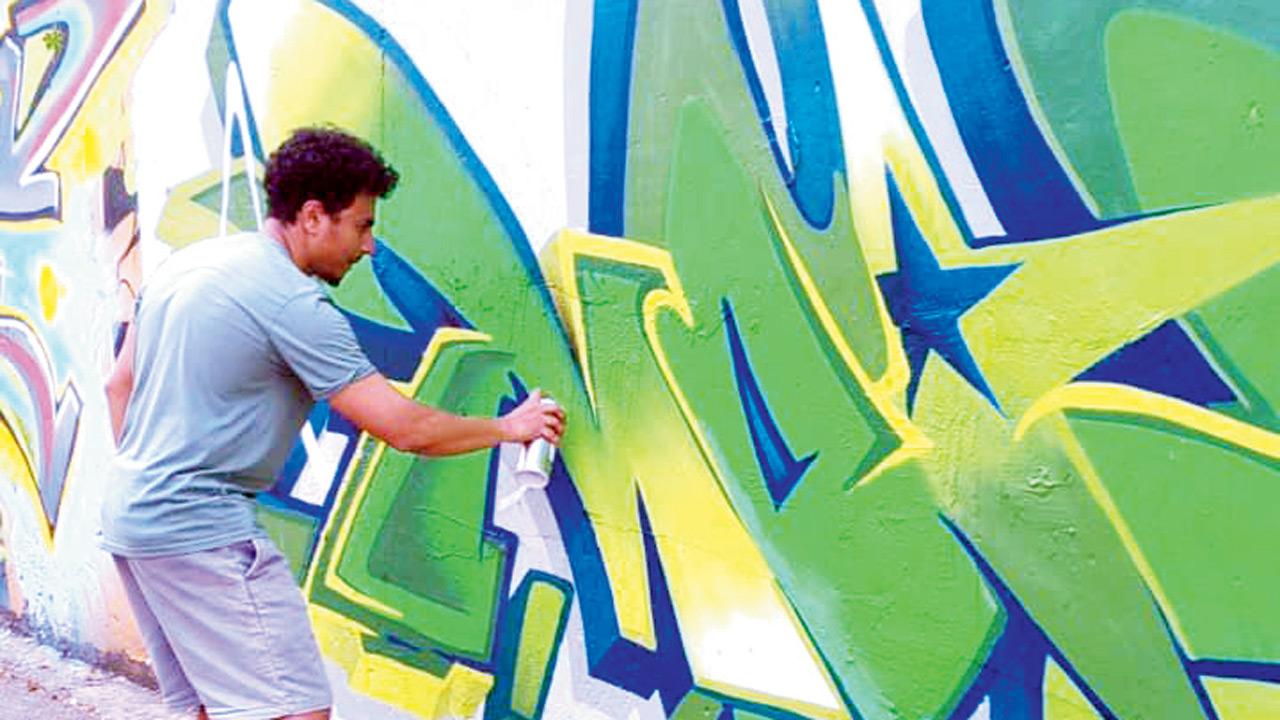 Raj Pathare paints graffiti in Marol 