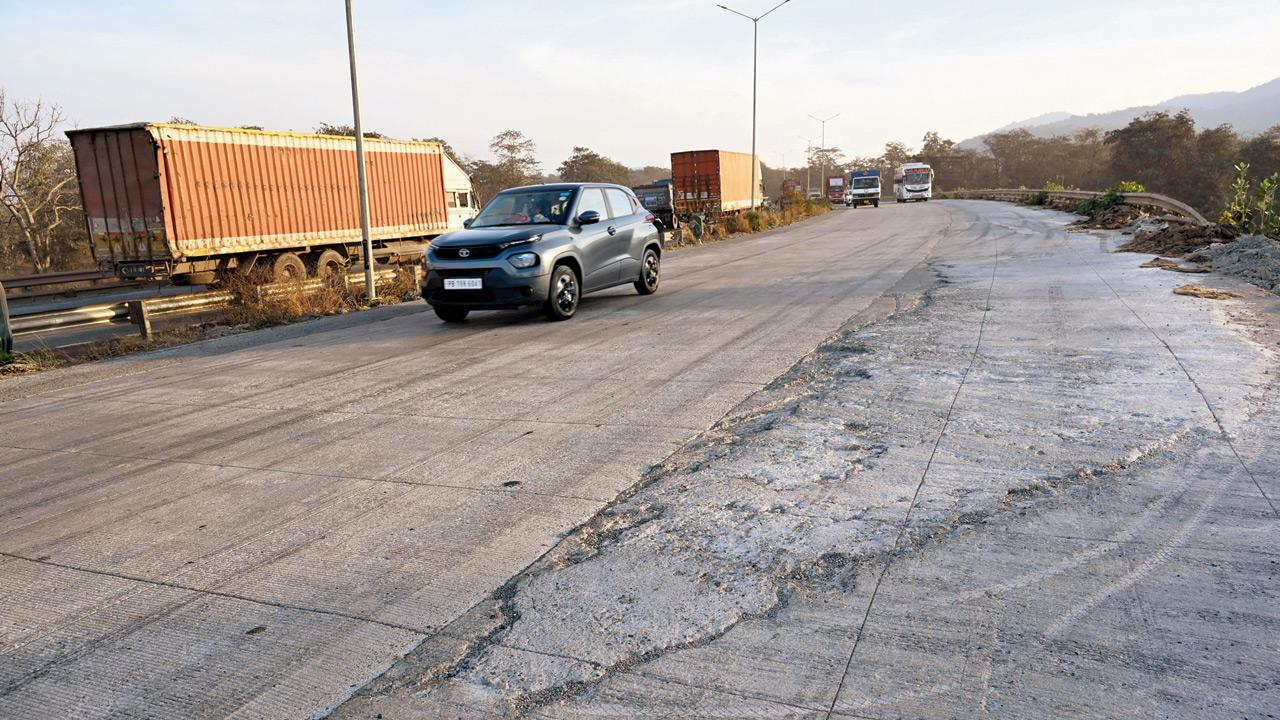 The uneven road surface on Varai flyover along NH 48, posing risks for motorists