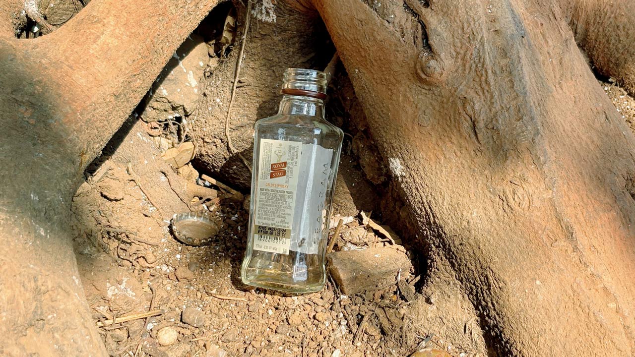 A bottle of liquor found littered. Pics/Ashish Raje