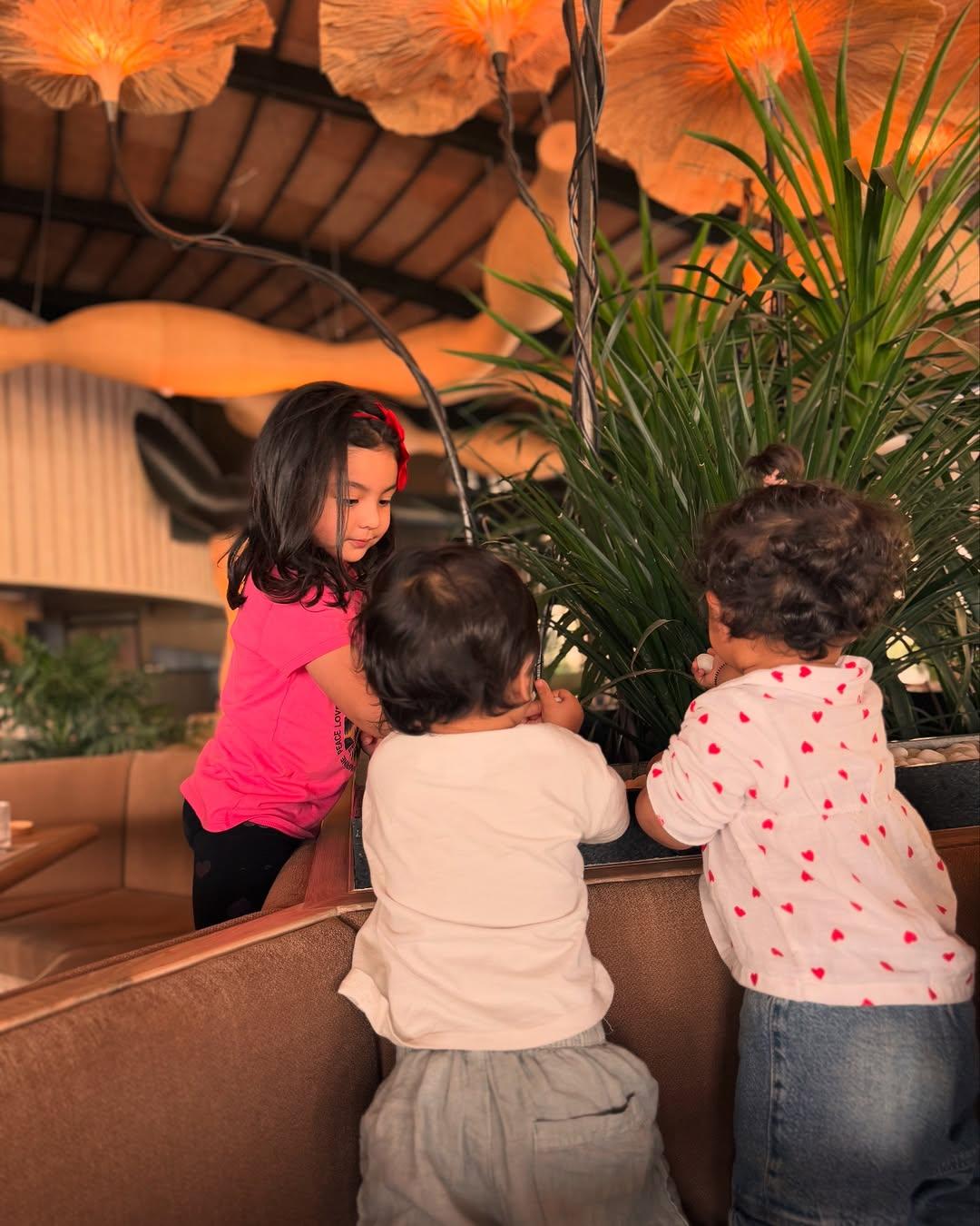 This picture has Jeeva and Edhaa playing with their friend
