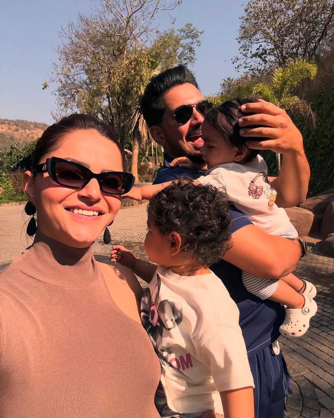 The perfect family moment! This snap has Rubina clicking a selfie as Abhinav and she hold their little princesses, Jeeva and Edhaa, in their arms